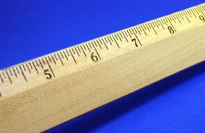 The ruler shows a small size of the penis
